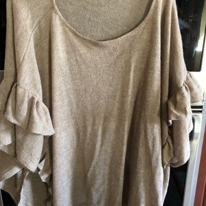 Poncho with ruffle sleeves